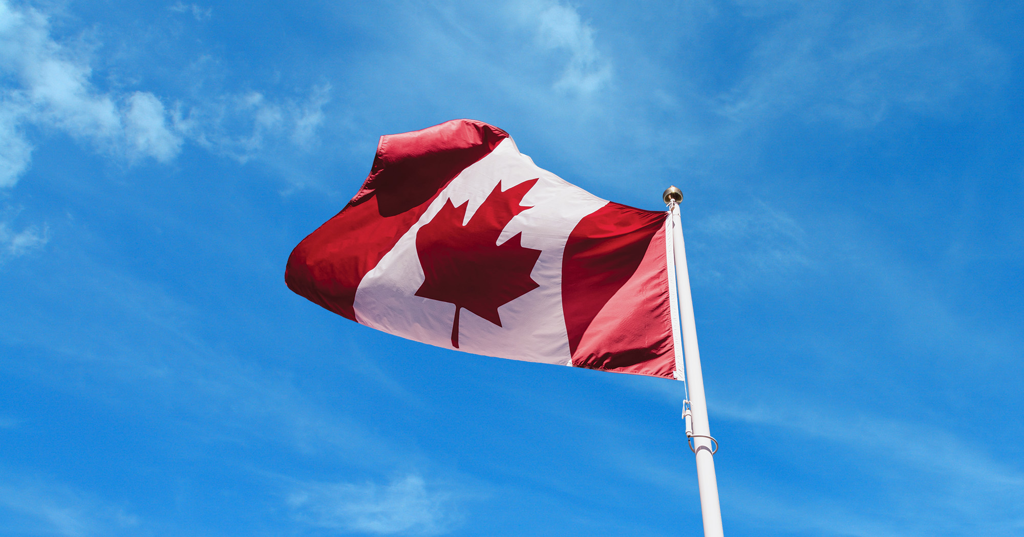 The Canadian flag billowing in the wind